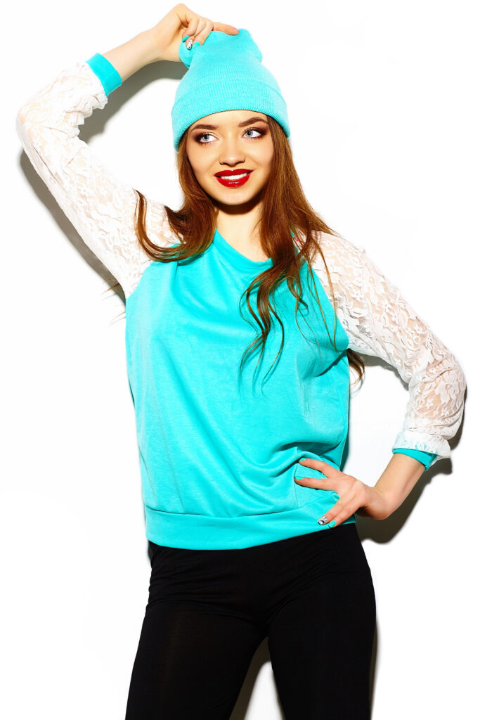 high fashion look.glamor stylish sexy beautiful young brunette woman model in summer bright blue hipster cloth in beanie